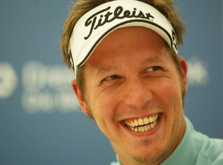 All smiles for Freddie Jacobson as he opens up with a 60 in Germany in 2003