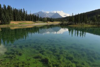 Mountains and forest reflecting on water, taken on Canon PowerShot G1 X Mark III