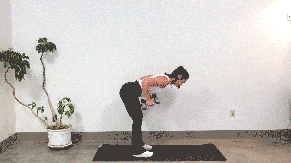 Trainer Kirra Mitlo doing dumbbell tricep kickbacks