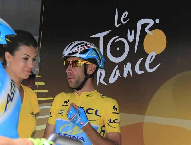 Vincenzo Nibali (Astana) signs in for his first day in the yellow jersey