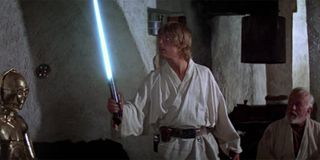 Luke wielding a lightsaber for the first time in A New Hope