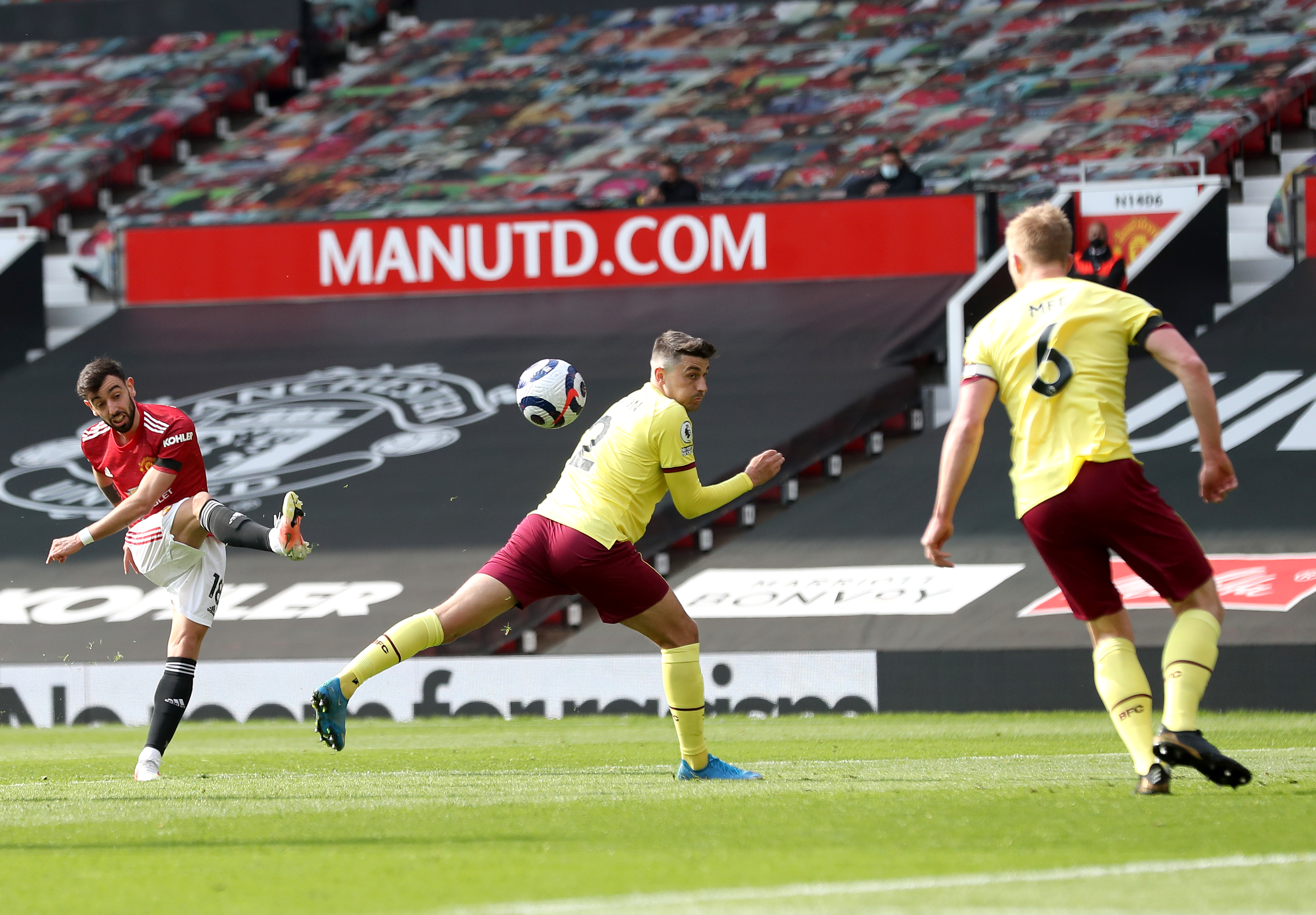 Bruno Fernandes, left, shoots on goal against Burnley