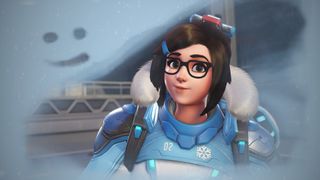 Overwatch's Mei mugs for the camera as she draws a smiley face in the frost of the screen.
