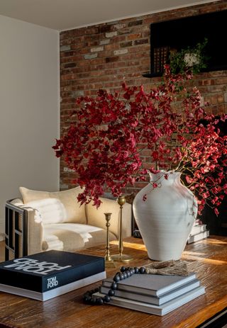 A living room with fall flower arrangement