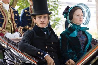 emily blunt rides in a carriage in a blue gown as Princess Alexandrina Victoria in the movie the young victoria