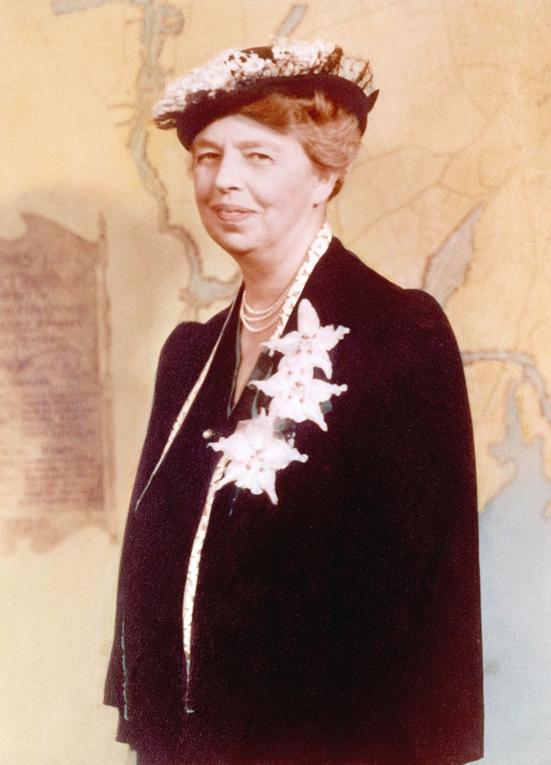 Eleanor Roosevelt stood in front of a map