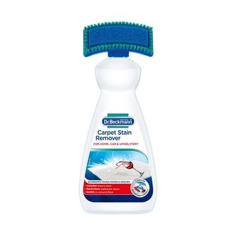 A bottle of Dr. Beckmann's carpet stain remover with a brush and sponge applicator built into the top