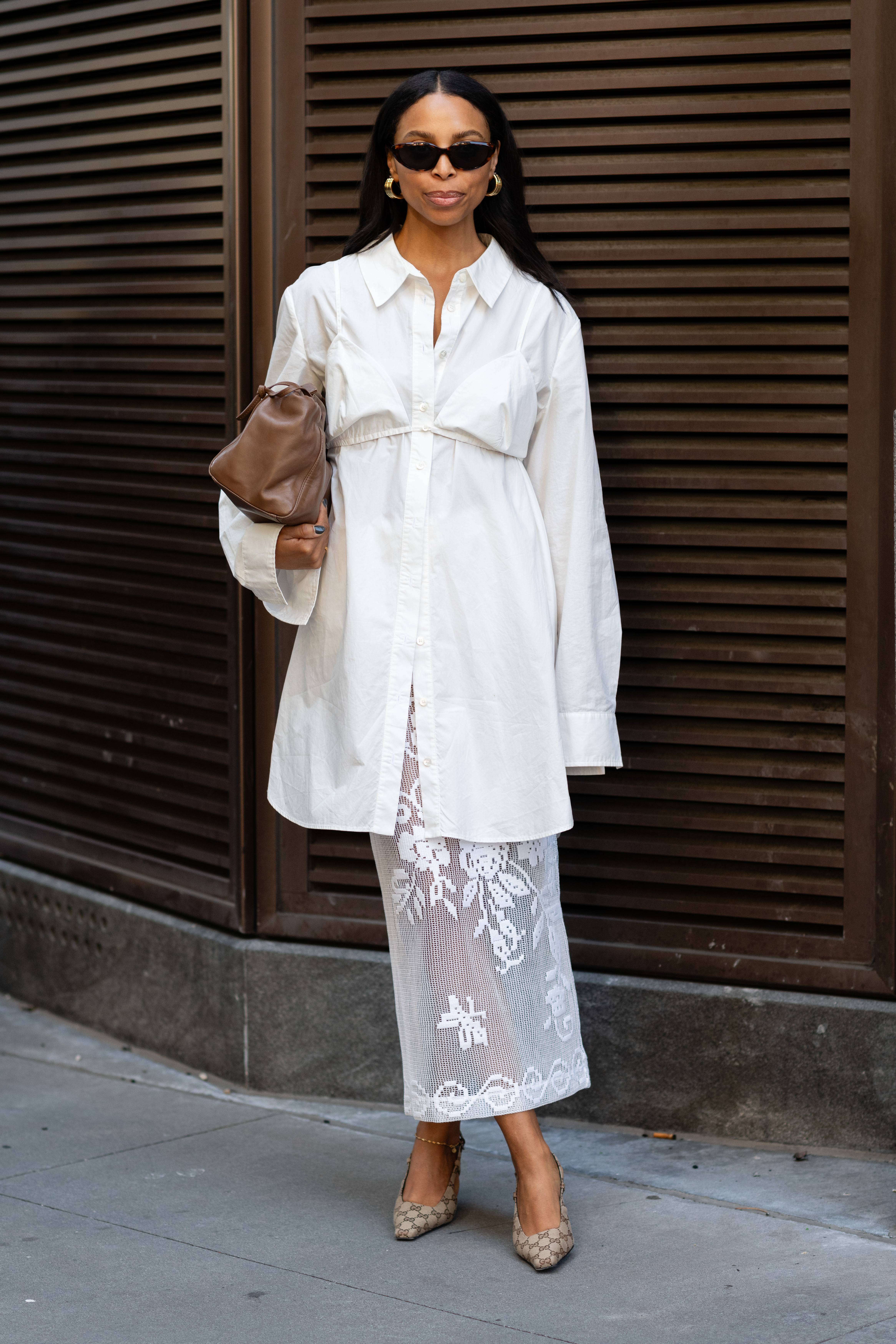woman wearing button-down shirt and sheer white skirt