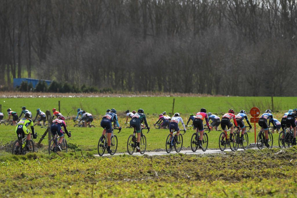 OETINGEN BELGIUM MARCH 14 The Peloton during the 1st GP Oetingen Womens Elite a 120km race from Oetingen to Oetingen Landscape gpoetingen on March 14 2021 in Oetingen Belgium Photo by Luc ClaessenGetty Images