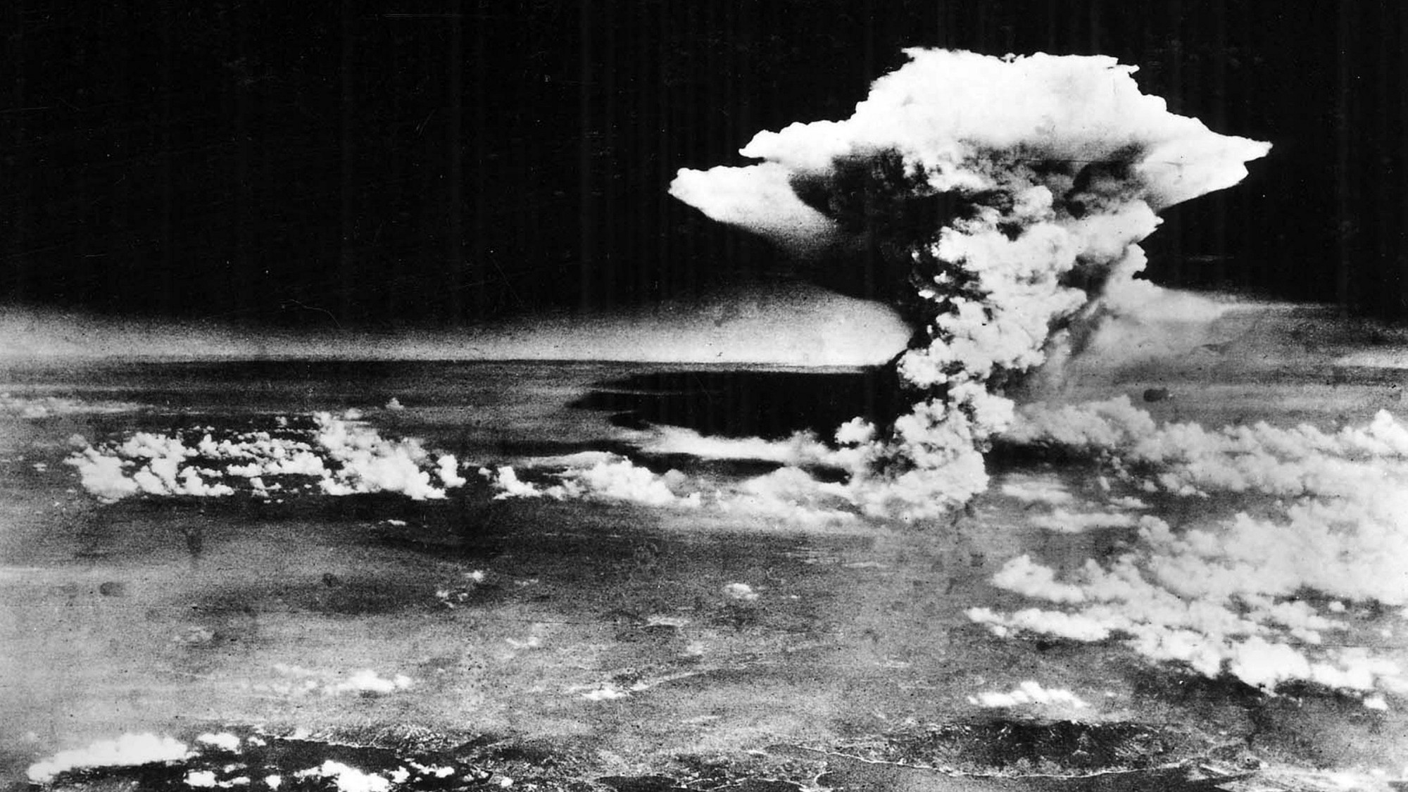 A mushroom cloud emanating from the detonated Little Boy atomic bomb