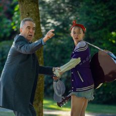 Elle de Lange as paige being pulled by her father by her father played by James Nesbitt in a still from netflix's harlan coben mystery run away