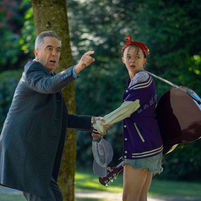 Elle de Lange as paige being pulled by her father by her father played by James Nesbitt in a still from netflix's harlan coben mystery run away
