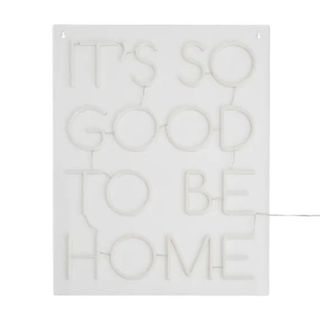 neon sign that says 'it's good to be home'