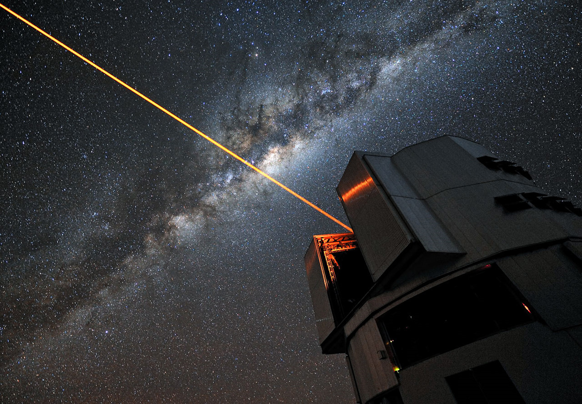 A glowing laser shines forth from the European Southern Observatory’s Very Large Telescope, creating an artificial star 90 km above the surface of the Earth used to fine-tune the telescope's optics.