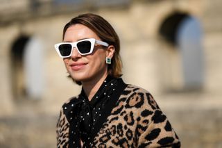 woman wearing white cat eye sunglasses