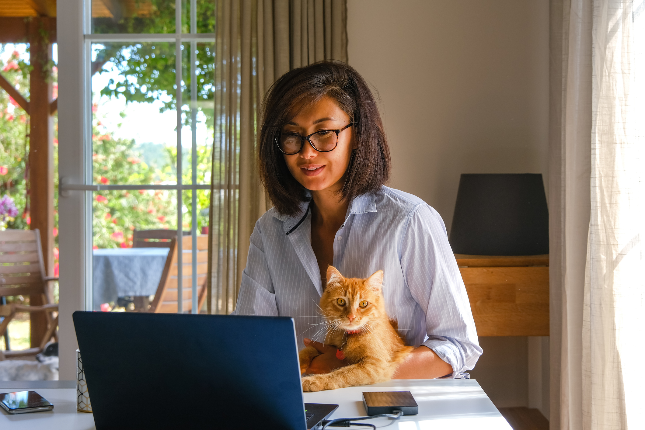 Asian woman working on laptop computer from home