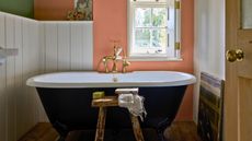 Small bathroom with freestanding tub and wall panelling
