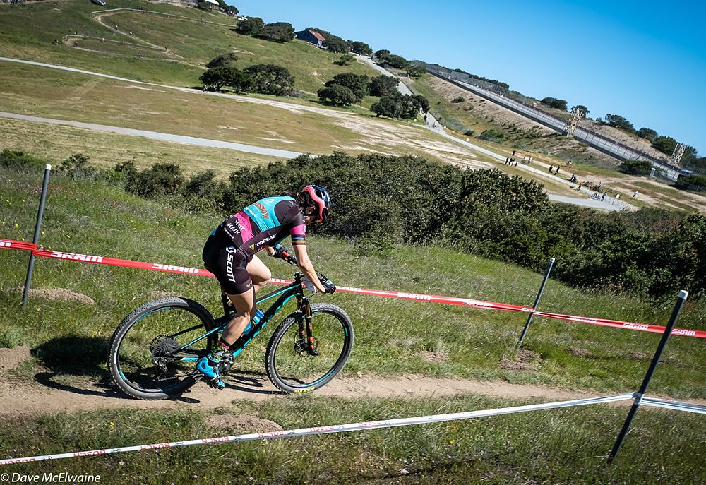 Former World Marathon Champion Sonya Looney riding across the top of the course