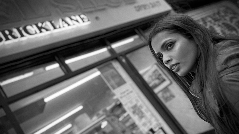 Model posing in front of a sign reading Bricklane