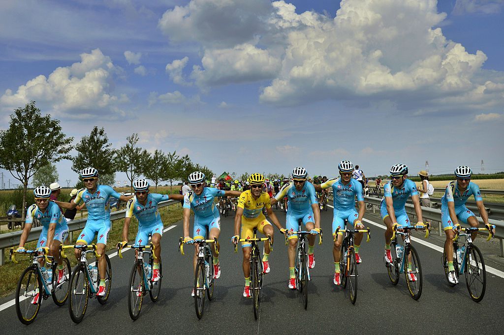 Italys Vincenzo Nibali C rides with his Kazakhstans Astana teammates prior to the start of the 1375 km twentyfirst and last stage of the 101st edition of the Tour de France cycling race on July 27 2014 between Evry and Paris AFP PHOTO JEFF PACHOUD Photo credit should read JEFF PACHOUDAFP via Getty Images