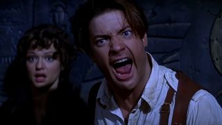 Rachel Weisz watches scared while Brendan Fraser yells in The Mummy.