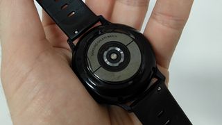 Samsung Galaxy Watch Active 2 review: watch laid out in hand revealing its heart rate sensor