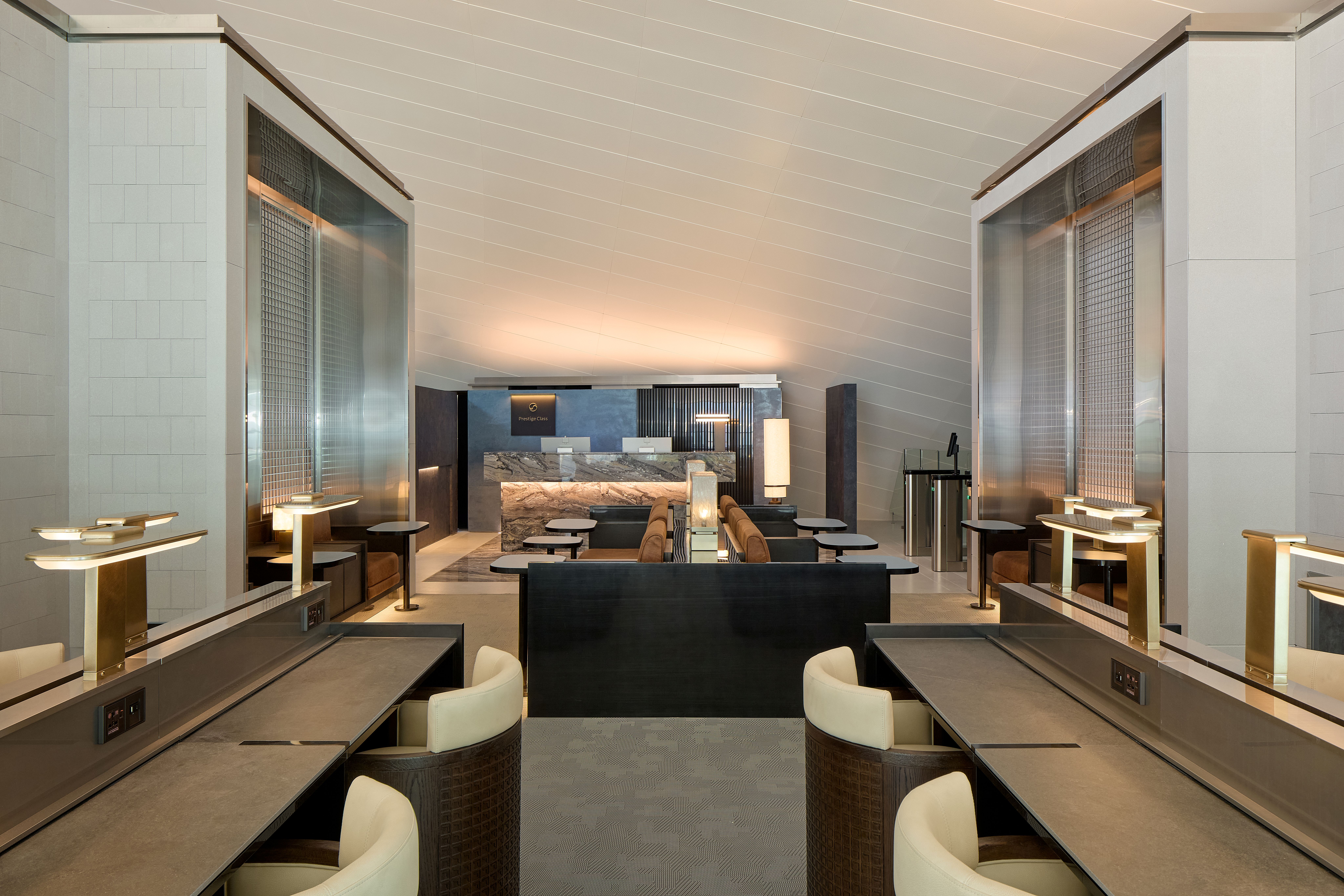 A spacious lounge interior at Incheon International Airport combines contemporary furnishings, natural textures and distinct areas for dining, work and relaxation