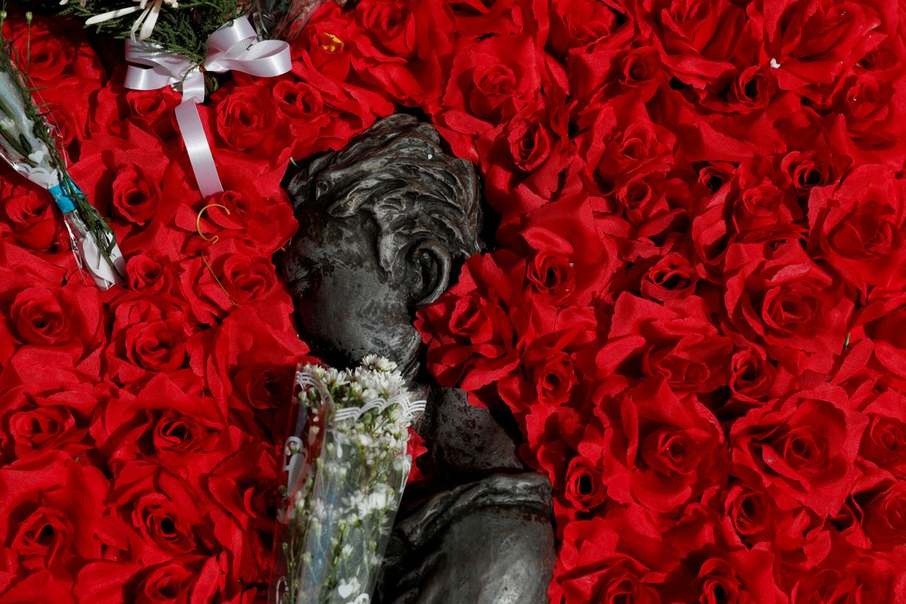 Flowers around a monument.