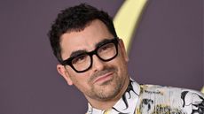 dan levy on a purple background