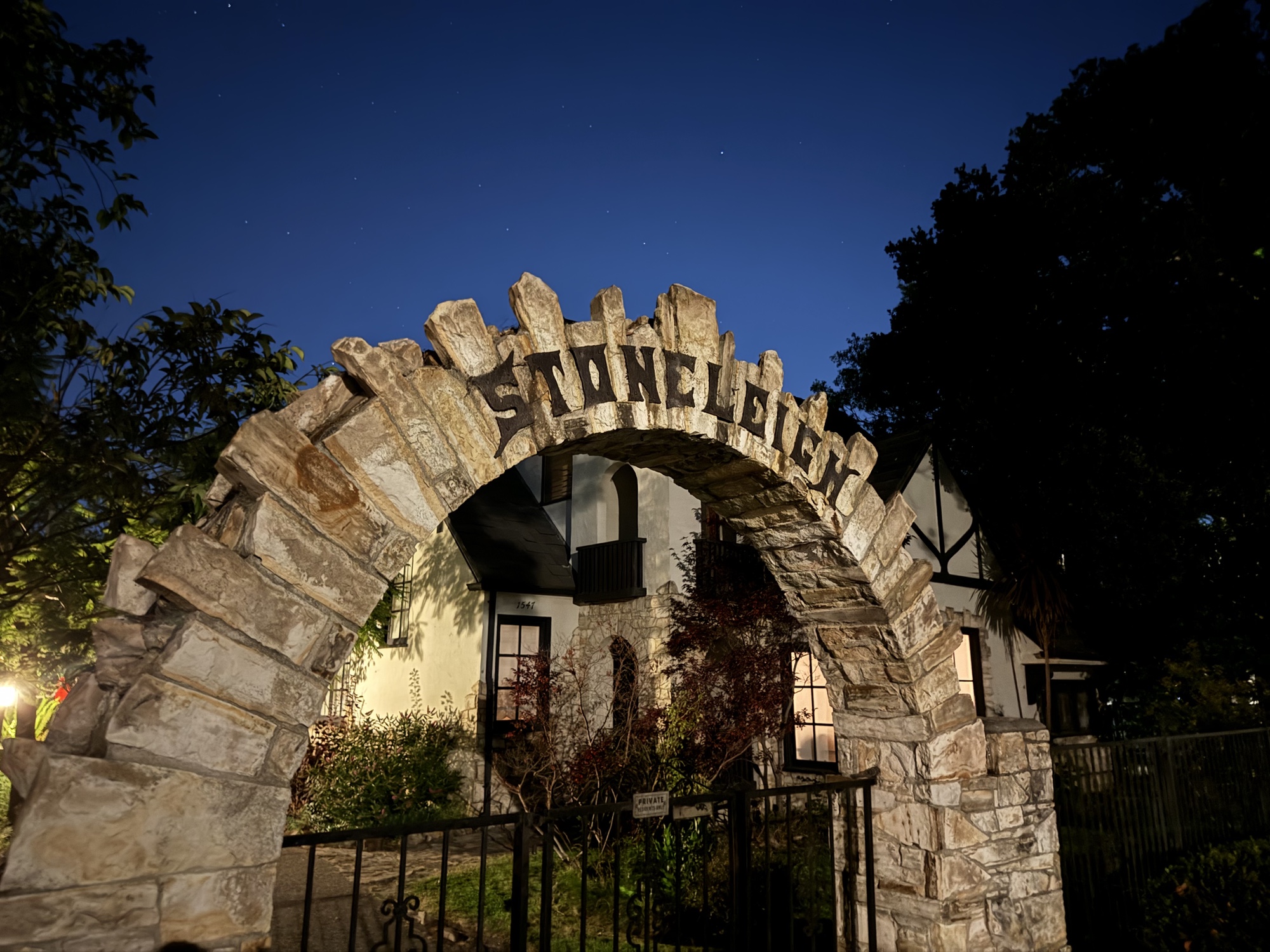 lettering on an archway at night photographed by iPhone 15 Pro