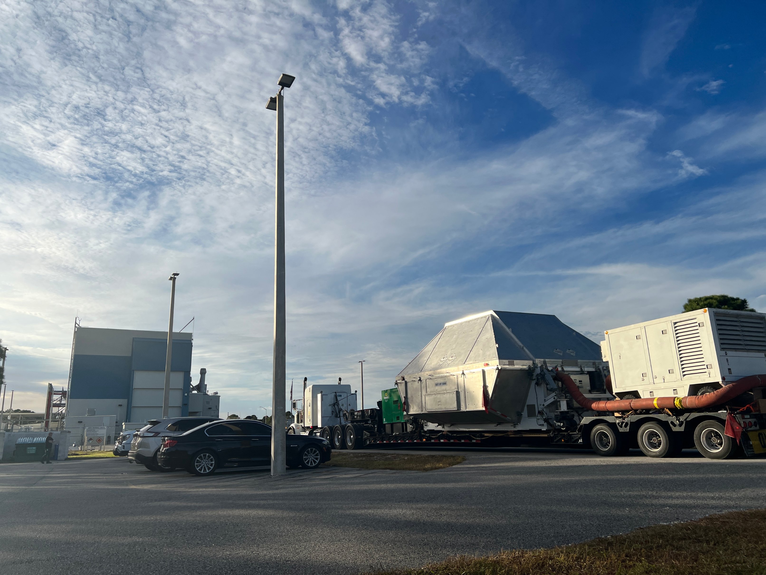 Members of the Artemis 1 team process and analyze the Orion Space Capsule arriving at the Kennedy Space Center in Florida on December 30, 2022.