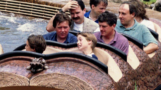 Prince William of Wales (front row, R) grimaces after he and friends of the royal family finished their ride 26 August 1993 on Splash Mountain at Disney World's Magic Kingdom in Florida
