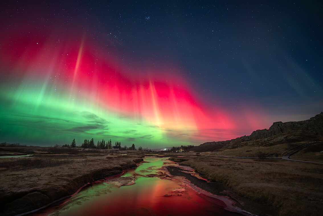 Northern Lights over a stream.