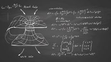 Equations that define black holes and wormholes written on a chalkboard.