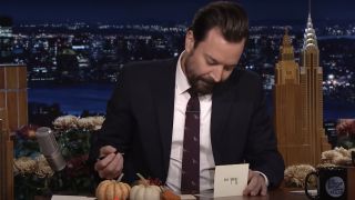 Jimmy Fallon writing out a Thank You note on The Tonight Show