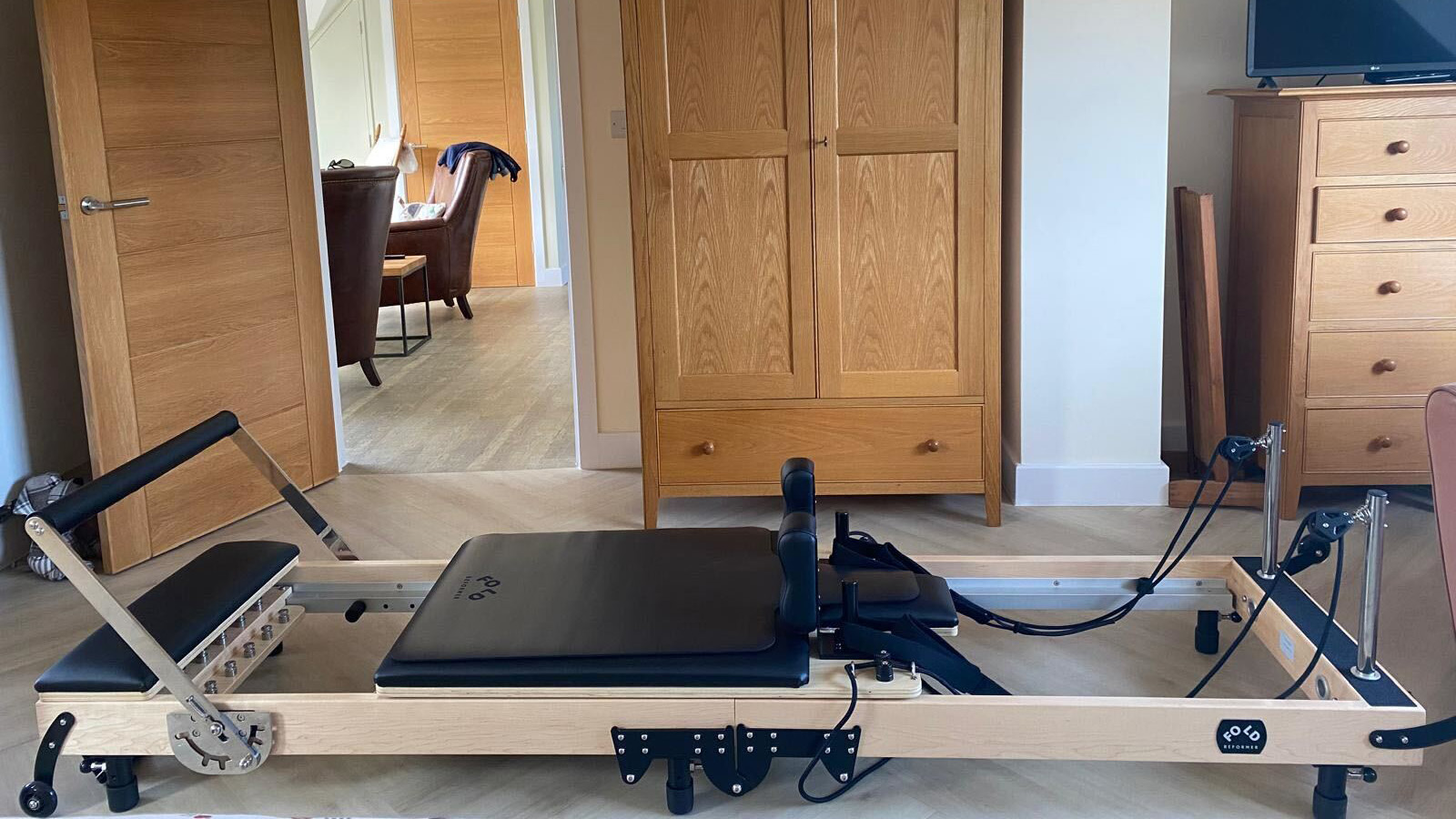 FOLD Reformer Pilates bed set up in bedroom