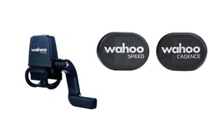 Wahoo speed and cadence sensors against a white background