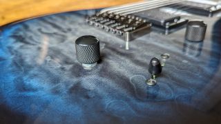 Close up of the push-pull tone knob on the PRS SE Mark Holcomb SVN