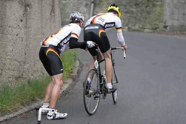 German rider Mario Vogt gets a push from teammate Kersten Thiele.