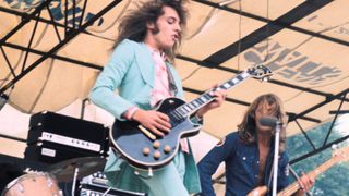 Peter Frampton rocks out at London's Hyde Park, 1971, with Greg Ridley in the background