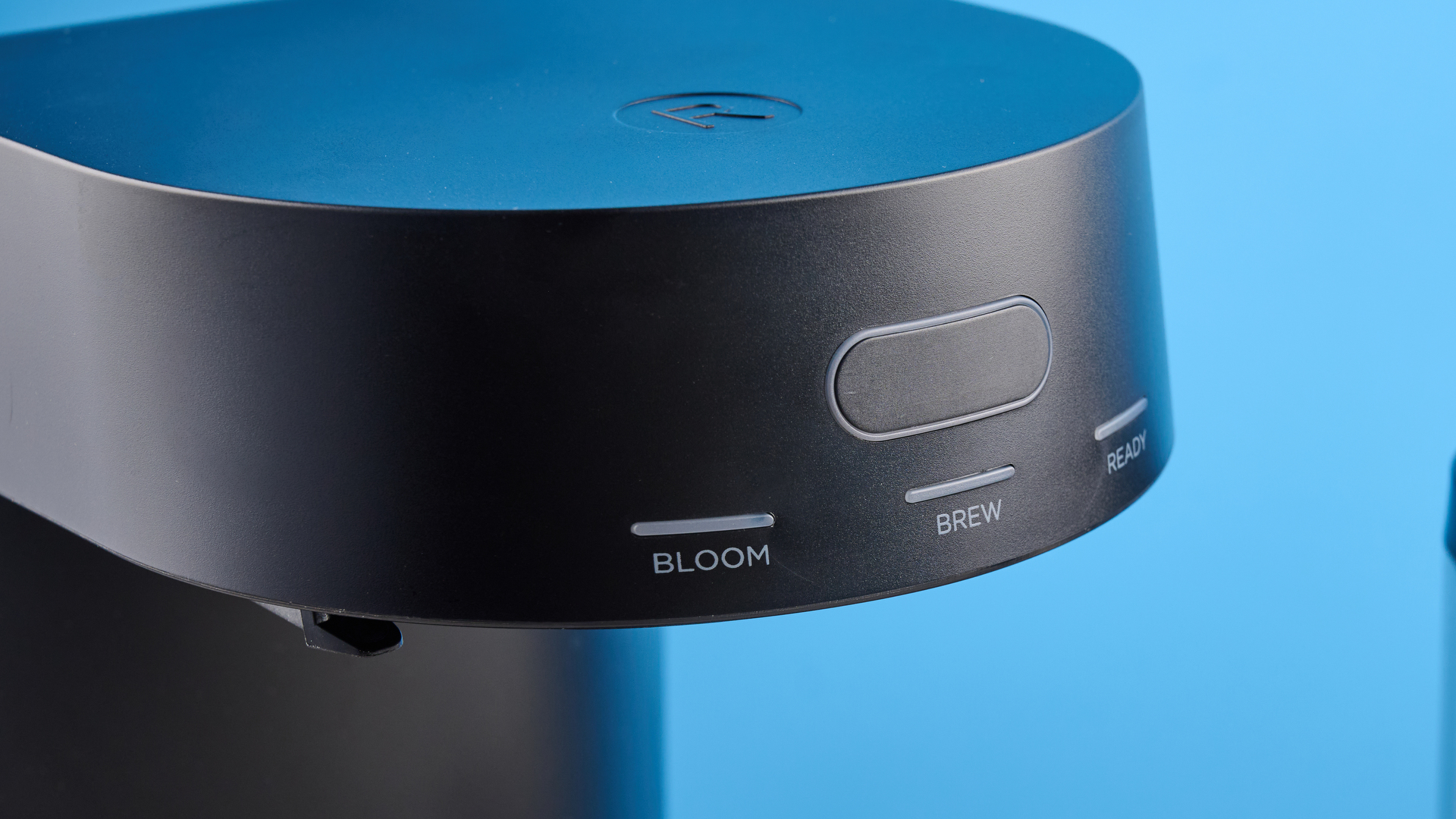 the ratio four coffee maker photographed against a blue tom's guide background