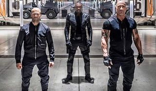Fast & Furious Presents: Hobbs And Shaw Hobbs, Brixton, and Shaw stand at attention in front of the