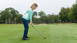 PGA pro Katie Dawkins about to hit a golf shot