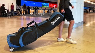 Dan Parker walking with the Ram FX golf travel bag in the airport