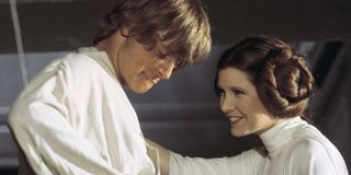 Mark Hamill and Carrie Fisher smiling as Luke and Leia