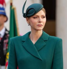 Princess Charlene wearing a green coat and hat
