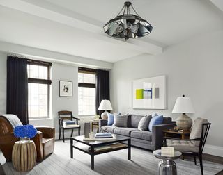 A living room with a grey palette