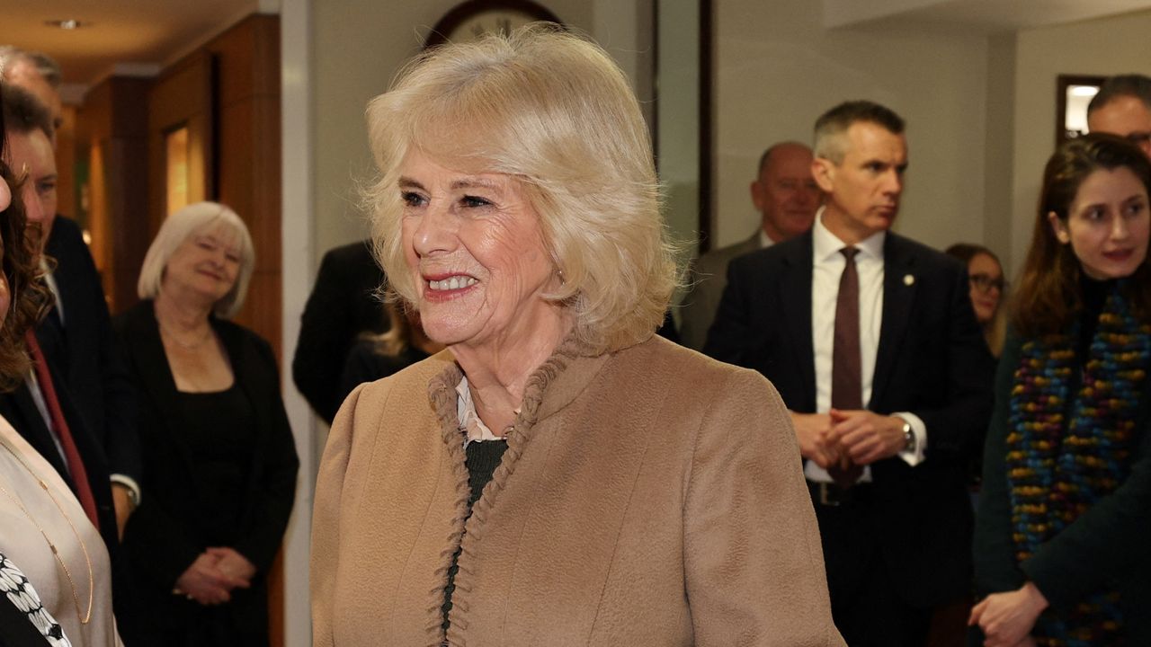 Queen Camilla meets members of staff during a visit to Deacon &amp; Son Jewellers in Swindon