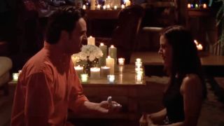 Matthew Perry as Chandler proposing to Courteney Cox as Monica surrounded by candles on Friends