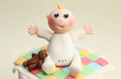 Baby cake decoration made from fondant
